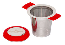 Load image into Gallery viewer, Front view stylish stainless steel loose leaf tea infuser with red silicone detail and lid that doubles as a saucer. In-cup tea infuser.