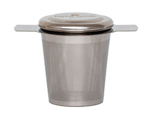 Load image into Gallery viewer, Front view stylish stainless steel loose leaf tea infuser with black silicone detail removed and lid that doubles as a saucer. In-cup tea infuser.