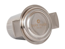 Load image into Gallery viewer, Side lying front view stylish stainless steel loose leaf tea infuser with red silicone detail and lid that doubles as a saucer. In-cup tea infuser.