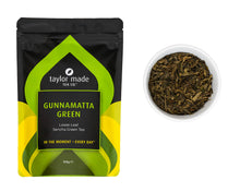 Load image into Gallery viewer, Gunnamatta Green organic loose leaf tea pouch with glass bowl containing green tea leaves.