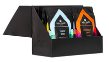 Load image into Gallery viewer, Discovery Box with luxury organic loose leaf teas and collagen peptides. Satin finish black box with 9 pouches of loose leaf tea and 1 pouch of collagen peptides powder. Gift Pack. Loose leaf tea gift pack. Open side view., 10 pouches standing in 2 rows of 5. 

